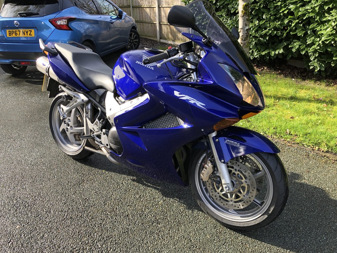 A blue Honda VFR sports tourer, photographed by a customer